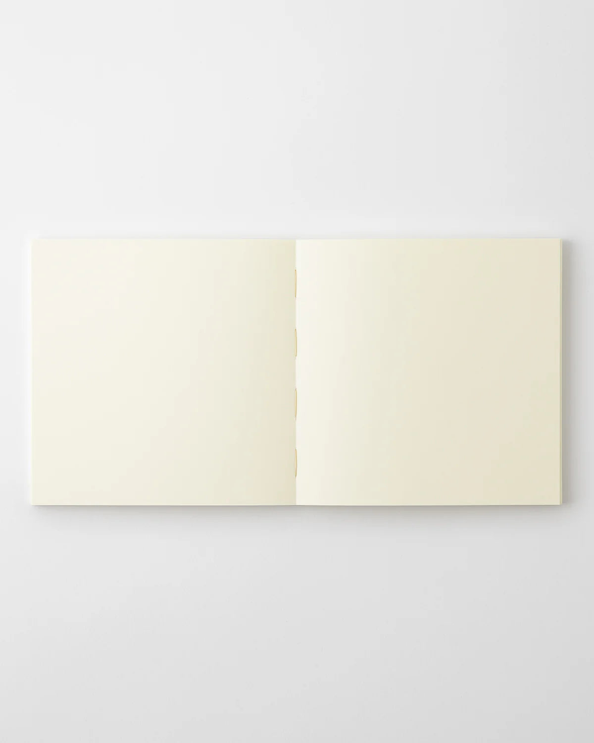 Open MD Notebook Thick A5 Square displaying blank, fountain‑pen‑friendly Midori MD pages.