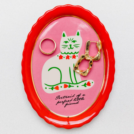 What better way to keep your cat from knocking trinkets off the table than with this adorable trinket tray? It’s got shiny gold accents but also scalloped edges to keep boop-able bobs safely in their place. Plans foiled, Whiskers. *Kisses forehead*&nbsp;