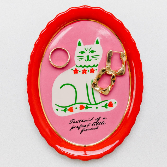 What better way to keep your cat from knocking trinkets off the table than with this adorable trinket tray? It’s got shiny gold accents but also scalloped edges to keep boop-able bobs safely in their place. Plans foiled, Whiskers. *Kisses forehead*&nbsp;