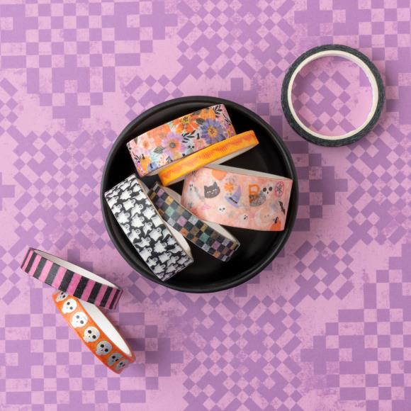 Add a touch of spooktacular charm to your creative projects with the Washi Tape from the Tricks And Treats Collection by Paige Evans for American Crafts.

This package includes eight rolls of tape featuring a variety of designs, such as pink and black stripes, skulls, ghosts, and more.

The rolls range in width from 0.375" to 0.875" and each measures six yards in length, giving you a total of 48 yards of tape to play with.

Whether you're decorating cards, scrapbook pages, envelopes, tags, journals, planner