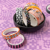 Add a touch of spooktacular charm to your creative projects with the Washi Tape from the Tricks And Treats Collection by Paige Evans for American Crafts.

This package includes eight rolls of tape featuring a variety of designs, such as pink and black stripes, skulls, ghosts, and more.

The rolls range in width from 0.375" to 0.875" and each measures six yards in length, giving you a total of 48 yards of tape to play with.

Whether you're decorating cards, scrapbook pages, envelopes, tags, journals, planner