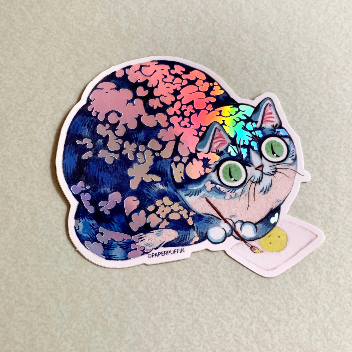 This larger sticker has a holographic finish.

+ size: 3”x 3” 
+ permanent adhesive glossy vinyl sticker with solid peel backing, holographic finish
+ scratch and weather resistant material, PVC free
+ packaged and shipped flat

All work and photos ©PAPER PUFFIN Art by. K.CARLSON
