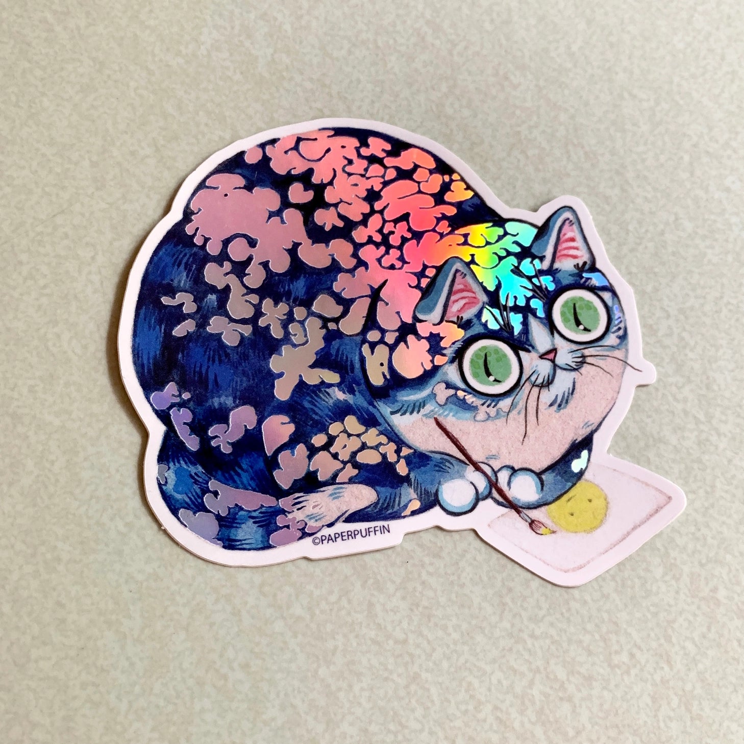 This larger sticker has a holographic finish.

+ size: 3”x 3” 
+ permanent adhesive glossy vinyl sticker with solid peel backing, holographic finish
+ scratch and weather resistant material, PVC free
+ packaged and shipped flat

All work and photos ©PAPER PUFFIN Art by. K.CARLSON