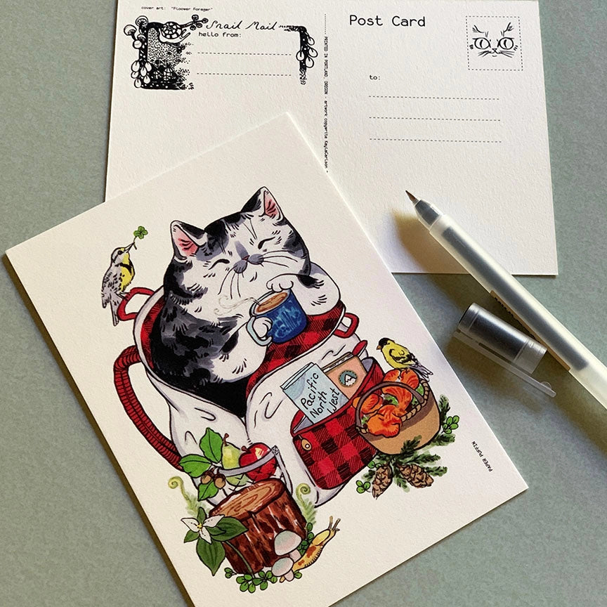 A happy camping cat, there are bits representing Oregon and Washington such as Meadowlark and Goldfinch birds, the iconic banana slug, trillium flowers and chanterelles, Douglas Fir... can you spot them all?

+ size: 4.25 x 6” standard size, regular postage stamp
+ printed on a ‘toothy’ rag off white color card stock paper
+ FSC 100% recycled environmentally friendly paper
+ created and printed in Portland, OR 


All work and photos ©PAPER PUFFIN Art by K.CARLSON