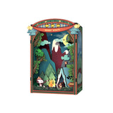 Gather 'round the campfire with Snoopy and his loyal Beagle Scouts in this heartwarming DIY Miniature Book Nook Kit! Nestled between trees and under the stars, Snoopy and the Woodstocks are toasting marshmallows over a crackling fire, their cozy tent pitched nearby. In the distance, gentle mountain silhouettes rise beyond the forest-setting the perfect scene for a peaceful, storybook escape.

This delightful book nook brings the charm of classic Peanuts adventures and the joy of outdoor camping into a beaut