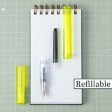 Kakuno is a delightful, new fountain pen that is ideal for both first time fountain pen users and experienced writers. Everyone can enjoy writing with a Kakuno fountain pen. "Kakuno" means "to write" in Japanese, and that's just what this pen helps users to do by featuring an appealing smiley face on the nib, when oriented upward, ensures perfect nib orientation. The NEW Kakuno Clear body features the Extra Fine, Fine and Medium Nib (with a tongue sticking out). Indentations in the cap make it easy to grasp
