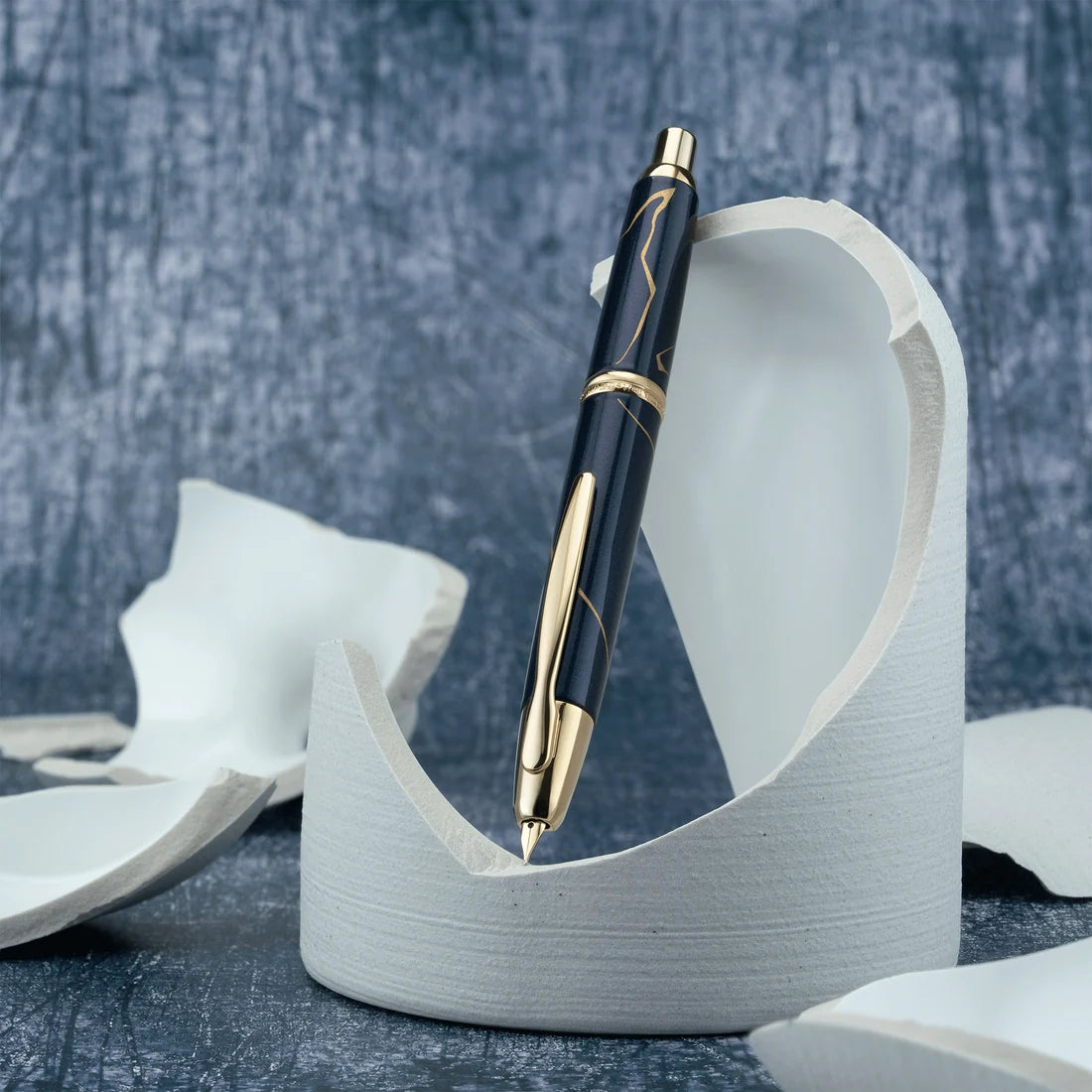 Pilot Vanishing Point Fountain Pen - Golden Journey - 2026 Limited Edition

Inspired by the Japanese art and philosophy of Kintsugi, Golden Journey honors the beauty found in transformation, resilience, and continuity. In Kintsugi, broken pottery is repaired with gold, allowing each line to become part of the object’s story rather than something to conceal. The 2026 Limited Edition brings this philosophy to life through a luminous pearlescent dark blue barrel accented with lines of metallic gold paint, crea