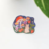 A cheerful little mouse pauses along a sunny garden path in Wildflower Woods, holding a ripe strawberry close before continuing on its way. This vinyl sticker captures that small, joyful moment, celebrating the simple pleasures tucked into everyday life.

Made from durable, waterproof vinyl, this sticker is designed to hold up wherever you place it—whether that’s a water bottle, laptop, or journal you reach for daily.