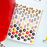 Your sticker stash is about to get very color-coordinated 🌈 Sticker the Rainbow Book Vol. 2: In Real Life is packed with 1500+ photorealistic stickers in every shade imaginable, from juicy lemons and shiny silver treasures to butterflies, vintage objects, florals, gems, and colorful everyday finds. With 30 pages of ultra-realistic stickers (plus 4 pages of alphabet + number stickers!), this book is basically a rainbow treasure hunt for your journal, planner, snail mail, laptop, or craft cart.