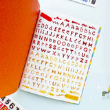 Your sticker stash is about to get very color-coordinated 🌈 Sticker the Rainbow Book Vol. 2: In Real Life is packed with 1500+ photorealistic stickers in every shade imaginable, from juicy lemons and shiny silver treasures to butterflies, vintage objects, florals, gems, and colorful everyday finds. With 30 pages of ultra-realistic stickers (plus 4 pages of alphabet + number stickers!), this book is basically a rainbow treasure hunt for your journal, planner, snail mail, laptop, or craft cart.