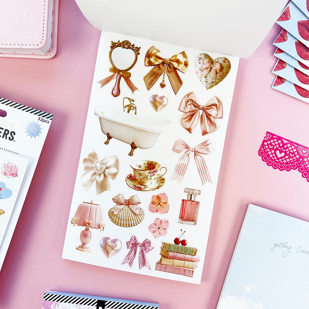 Sweet, nostalgic, and a little bit extra—in the best way. The Coquette Junk Journal Sticker Book is packed with all the pretty details your pages have been waiting for. Think bows, florals, frames, patterns, alphabets, and darling vintage-inspired bits made for layering, collaging, and documenting every little moment.