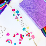Take your current read anywhere! This rainbow strap turns your favorite book or journal into an instant crossbody so you can read on the go, hands-free and in style. Perfect for book lovers, travelers, and sticker-covered notebooks alike!




