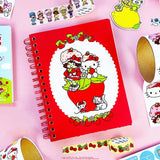 A tiny notebook with major main character energy 🍓💌 Covered in the sweetest strawberry + Hello Kitty details, it’s perfect for quick notes, doodles, and lists you’ll actually want to write. Small enough to toss anywhere, cute enough to show off everywhere.

A bright red spiral notebook featuring Hello Kitty sitting in a strawberry, framed with a white scalloped oval and tiny floral details 🍓 The smooth cover pops with bold color, while inside you’ll find lined pages with coordinating strawberry accents a