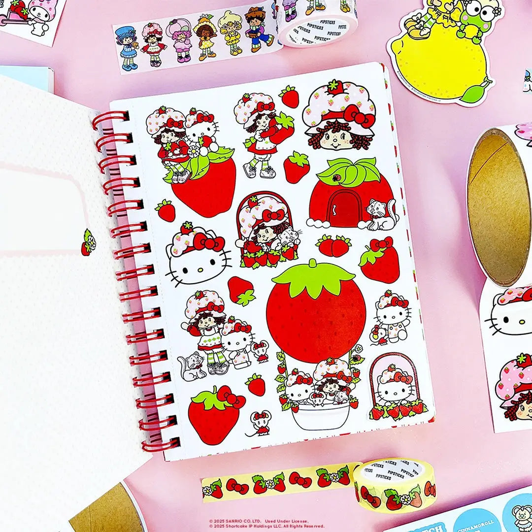 A tiny notebook with major main character energy 🍓💌 Covered in the sweetest strawberry + Hello Kitty details, it’s perfect for quick notes, doodles, and lists you’ll actually want to write. Small enough to toss anywhere, cute enough to show off everywhere.

A bright red spiral notebook featuring Hello Kitty sitting in a strawberry, framed with a white scalloped oval and tiny floral details 🍓 The smooth cover pops with bold color, while inside you’ll find lined pages with coordinating strawberry accents a