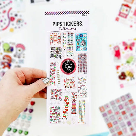 LIMITED EDITION COLLECTIBLE!

PipStickers are the PERFECT gift for the sticker lover in your life - even if it's you! These unique PVC designs with holographic silver foil accents come on a clear backing and cannot be found anywhere else.

Includes one 3" x 7" sheet of Kids Collections Vol 1: Love is in the Air PipStickers and includes the Pipsticks manifesto.