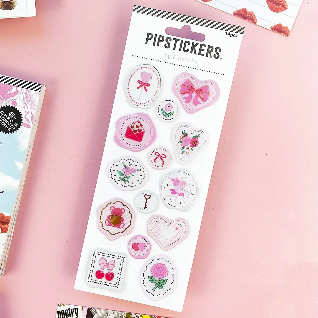 Add an extra bit of fun to your snail mail, invitations, thank you cards, gift tags, scrapbook or craft project! Wax Seal stickers look as cool as the real thing - without the mess! Just peel & stick - that's all!

Includes one 3" x 7" sheet of Seal Of Love Pipstickers.