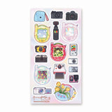📸✨ Say cheese! From chunky digicams and instant printers to retro film cameras and pocket-sized pixel pets, this snap-happy sheet by @annadotpng is fully loaded with snapshot nostalgia. It’s a shutterbug’s dream, packed with dreamy screens and gadgets that totally flash back. Ready to capture some sticker magic? Point, shoot, print, repeat!

Art by: @annadotpng

Top Coating: Holo Glitter
Adhesive Layer: PVC (plastic)
Backing Layer: Clear PET
6.69" x 3.54".
Weight - 0.03lbs.
1 sheet included &nbsp; &nbsp;