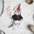 Unlock your inner magician with our Mystical Cat Magician Vinyl Sticker. This captivating sticker showcases a spellbinding feline conjuring sparkling stars and enchantment from the cosmic abyss. It's a symbol of the limitless enchantment that lies within you. Apply this sticker to any surface - it adheres effortlessly to your laptop, journal, water bottle, and more.