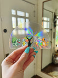 Pokemon Inspired (featuring Umbreon, Mew, Charmander, Squirrel, & Bulbasaur) rainbow prismatic window decal.