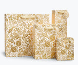 Giving gets even more special with our gift bags, which feature charming extras like gold foil accents, cotton ribbon handles, and a coordinating “To” and “From” tag.

DETAILS

Small: 6 x 4.5 x 0.3 in
Coated paper with cotton ribbon handles
Printed in full color and UV gold glitter
Gold lurex ribbon handles
Cardboard floor insert