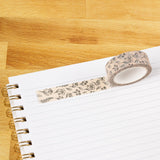 Pressed Floral Washi Tape

Our washi tape is made for paper lovers, pen pals, and anyone who gets butterflies in the stationery aisle. Perfect for journaling, scrapbooking, decorating envelopes, or adding a personal touch to planners and calendars. It's gentle on paper, easy to tear by hand, and removable without leaving residue, so you can rearrange, redo, and re-stick as needed.

Design Features:&nbsp;

Each roll measures 15mm wide on a 10m roll
Full color repeating pattern
Washi tape dispenser packaging
