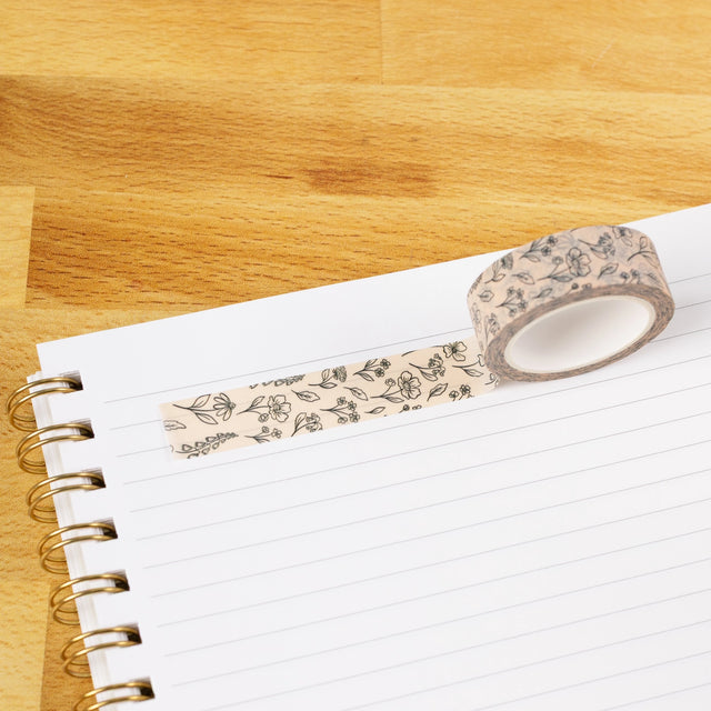 Pressed Floral Washi Tape

Our washi tape is made for paper lovers, pen pals, and anyone who gets butterflies in the stationery aisle. Perfect for journaling, scrapbooking, decorating envelopes, or adding a personal touch to planners and calendars. It's gentle on paper, easy to tear by hand, and removable without leaving residue, so you can rearrange, redo, and re-stick as needed.

Design Features:&nbsp;

Each roll measures 15mm wide on a 10m roll
Full color repeating pattern
Washi tape dispenser packaging
