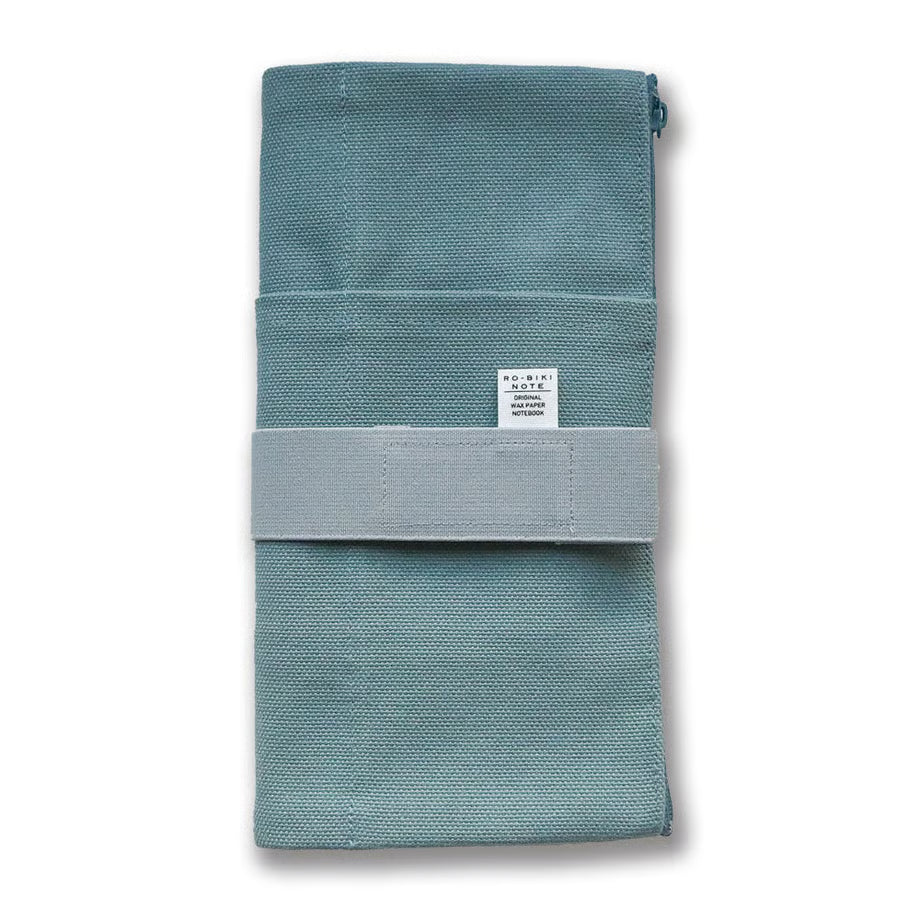 Made of cotton that feels good to the touch, this is RO-BIKI NOTE CANVAS COVER vintage blue. A zippered pocket on the side is useful for storing stationery that tends to be loose. It has a simple design that does not stand out when carrying. When closed, it feels neat and sizable. The surface of the cover has three pockets of different sizes, so you can enjoy multiple storage options.&nbsp;

With a connecting band, you can sandwich the Basic size and the passport size at the same time.