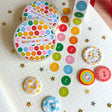 Add some color to your journal and crafts with this cute button themed washi tape designed by Veronica!

Perfect for crafts, journaling, snail mail, and more.

Size: 15mm x 10m
