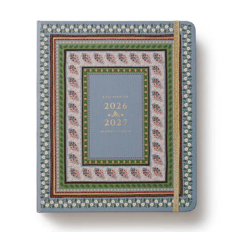 Start planning ahead with our 17-month planner. A sturdy hard cover with gold accents wraps over an interior spiral binding with a metallic band to hold the pages closed. Inside you’ll find monthly and weekly views, inspirational quotes, sections for notes and goals, an illustrated pocket folder, and 3 pages of stickers. Planners span August 2026-December 2027.

DETAILS


Printed in full color with foil stamped year
Textured coated paper cover
Natural white text paper interior
August 2026-December 2027
Week