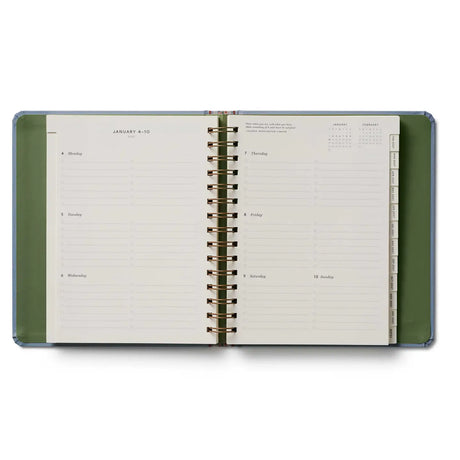 Start planning ahead with our 17-month planner. A sturdy hard cover with gold accents wraps over an interior spiral binding with a metallic band to hold the pages closed. Inside you’ll find monthly and weekly views, inspirational quotes, sections for notes and goals, an illustrated pocket folder, and 3 pages of stickers. Planners span August 2026-December 2027.

DETAILS


Printed in full color with foil stamped year
Textured coated paper cover
Natural white text paper interior
August 2026-December 2027
Week