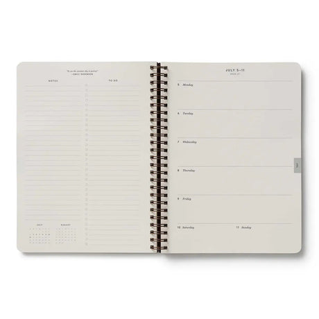 Our softcover spiral planner features a canvas paper cover printed with Hydrangea florals and a gold foil year. Inside you’ll find monthly and weekly views, plenty of space for notes, a list of celebrations, and pockets for storage.&nbsp;

DETAILS

Printed in full color with foil stamped year
Canvas paper cover with white text paper interior
January 2027-December 2027
Monthly and weekly views
Space for notes each week
List of celebrations
Pockets for storage
Spiral bound

6.25" W x 8.5" L