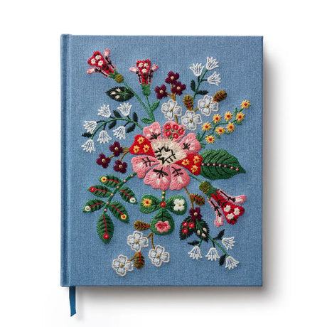 Our embroidered sketchbook is a large, hardcover journal with 108 unlined pages, perfect for sketching, drawing, and journaling. The cover is wrapped in blue book cloth and embroidered with our Gracie florals. Inside, an attached grosgrain ribbon bookmark will save your place.