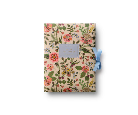A prettier stationery stash, perfect for writing on the go. Printed with Gracie florals in three elegant colorways, this folio-style set includes 12 notecards with matching envelopes, tucked inside a coordinating folder with a ribbon-tie closure.