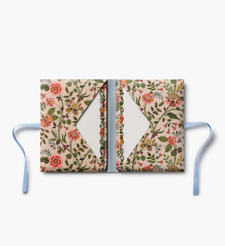 A prettier stationery stash, perfect for writing on the go. Printed with Gracie florals in three elegant colorways, this folio-style set includes 12 notecards with matching envelopes, tucked inside a coordinating folder with a ribbon-tie closure.