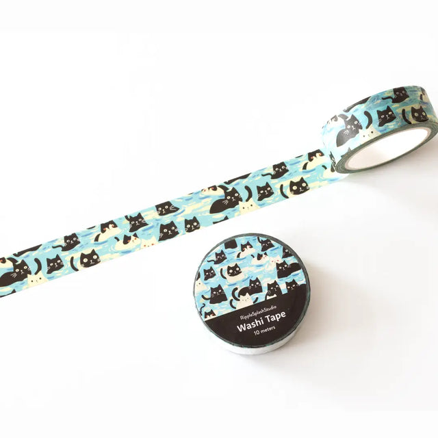 Decorative washi tape featuring playful illustrated cats in a repeating pattern on a soft blue background. Perfect for planners, journals, gift wrapping, scrapbooking, and creative projects. Easy to tear, repositionable, and residue-free.

🌈 Key Features:

Dimensions: 15mm wide x 10 meters (32.8 feet) in length&nbsp;
Contains: 1 washi tape roll

High-quality washi tape material
Easy to tear and reposition
Perfect for scrapbooking, journaling, and crafts
