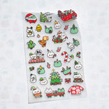 This is part of a new series of sticker sheets that feature different "days".

There are 33 individual glitter stickers on the sheet full of holiday joy!

They are plastic stickers on a frosted plastic sheet with a backing card and packaging that's ready to display.