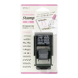 This fun rotating stamp by Midori allows you to choose from several designs and patterns that come with each stamp. The rotating stamp comes with an ink pad to be installed into the stamp before beginning to use it. Lock buttons on the side of the stamp allow you to lock the stamp into place when changing out the ink pad and when changing between designs to avoid mess.