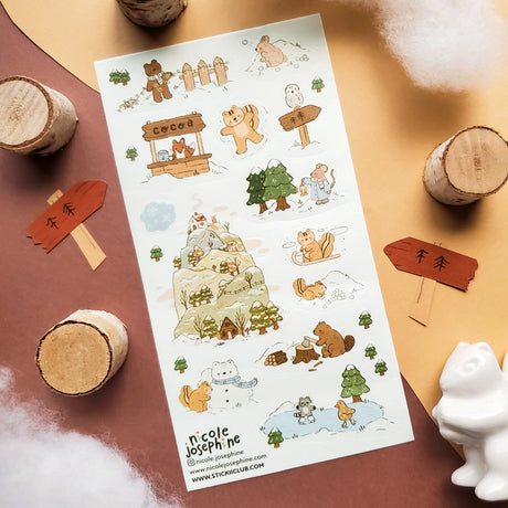 ❄️🐻 Bundle up for a heartwarming winter tale with these woodland cuties by @nicole.josephine! Bears, squirrels, foxes, and bunnies spend snowy days sipping cocoa, building snowfriends, and ice skating across frozen ponds. From lantern-lit strolls through pine forests to cozy cabins, this sheet is filled with all the magic of a perfect winter day.