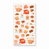 🧺🍯 Pack your blanket for the coziest little picnic! This darling sheet by @yomihonei is filled with flaky croissants, chocolatey buns, chunky cookies, golden loaves, buttery toast, and jars of honey all nestled on a gingham spread. With an adorable bear friend busy filling baskets and tying up tasty treats, it’s a kawaii afternoon of sunshine, crumbs, and cuddly bakery bliss. These stickers will add a drizzle of honeyed happiness wherever you stick them!

Art by: @yomihonei

Top Coating: None
Adhesive Lay