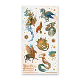 🦄🐉 Soaring through starlit skies and shimmering seas, @hopechristofferson’s mythical beings awaken a realm of untamed magic and ancient wonder. From a winged alicorn and celestial dragons to radiant sirens and cosmic creatures, get ready to weave epic fantasy tales and fill your pages with legendary beauty with this breathtaking sheet.

Art by: @hopechristofferson

Top Coating: Gold Foil
Adhesive Layer: Paper
Backing Layer: Paper
6.69" x 3.54".
Weight - 0.03lbs.