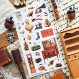 STICKII - Treasured Antiques Sticker Sheet

🕰️🧳 Brimming with timeworn treasures, this sheet feels like a quiet afternoon spent wandering through an antique shop. From ornate clocks and old sewing machines to travel trunks, violins, gramophones, and carefully kept curios, each piece captures the charm of objects with a story to tell. Perfect for adding a little old-world elegance, mystery, and nostalgia to your pages.

Top Coating: None
Adhesive Layer: Paper
Backing Layer: Paper
6.69" x 3.54".
Weight - 0.