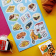 STICKII - Yummy Street Food Sticker Sheet

Grab some deliciousness on-the-go with our street food stickers! Have you ever wanted to lick a sticker sheet before? This is a first for us too...

Art by: @kawaiibroccolii
Top Coating: Matte
Adhesive Layer: PVC (plastic)
Backing Layer: Clear PET
6.69" x 3.54". Weight - 0.03lbs.
1 sheet included&nbsp;