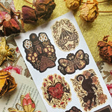 🌙🪲 In this twilight garden by @zanetaantosik, moths, beetles, and shadowy creatures bloom among ornate florals and eclipsed moons. A black cat prowls through curling vines, velvet wings unfurl, and a bat drifts silently across shadowed blossoms — each creature a guardian of this enchanted realm. Perfect for those who find wonder in the dark and poetry in the wild. Art by: @zanetaantosik

Top Coating: Gold Foil
Adhesive Layer: Paper
Backing Layer: Paper
6.69" x 3.54".
Weight - 0.03lbs.
1 sheet included &nb