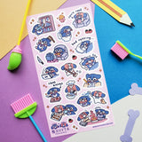 STICKII Crisis & Mocha Sticker Sheet

🐶💤 Meet Crisis & Mocha, just doing their best trying to get through the week (like us). Whether they’re starting fires while tcooking dinner, binge-watching, or just vibing in a disaster of their own making, this sheet by @xiiyta is a reminder that yes we’re all a mess but we’re an adorable mess so it’s okay or something.