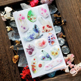 💐✨ Discover crystal magic with this gorgeous sheet of quartz crystals blooming with colorful flowers within. These charged crystals are perfect for adding some sparkle and good vibes to your spreads! 
