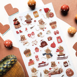 🐭☕️ Cozy up with @nettleandtwig’s snug little mouse village, where winter days are filled with woolly sweaters, steaming cocoa, and muffins fresh from the oven! Among snow-dusted acorn cottages, these tiny friends spend their time sledding, knitting, and sharing warm moments by the fire.

Top Coating: None
Adhesive Layer: PVC (plastic)
Backing Layer: Clear PET
6.69" x 3.54".
Weight - 0.03lbs.
1 sheet included&nbsp;