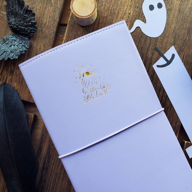 Time to add a little magic to your sticker stash! ✨ Our new Halloween duo has arrived — two perfectly spooky (and irresistibly cute) organizers ready to keep your collection spellbound all season long. Whether you're brewing up cozy crafts or flying into spooky season fun, these organizers will keep your collection safely tucked away in style! 💫

Each organizer features a vegan leather cover with a shimmering gold foil emblem and holds up to 48 sticker sheets across 24 pages.