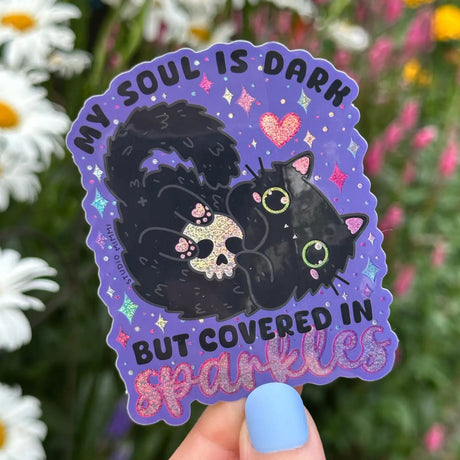STUDIO Mimi - My Soul Is Dark But Covered in Sparkles Vinyl Sticker

I said, “my soul is dark, but covered in sparkles” to a friend and they exclaimed, “That needs to be on a sticker!” Hahaha, so here it is!

Couldn’t have a sticker design like this without a black cat and glitter holo! Even the toe beans are sparkly!

Weatherproof vinyl with glitter holographic details.
Size 2” x 3” (inches)