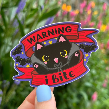 STUDIO Mimmi - Warning I Bite Vinyl Sticker

Tiny, adorable, fuzzy… but dangerous! Little danger! You’ve been warned: this cutie bites!

Weatherproof vinyl in a super matte finish.

Size 2.2” x 3.5” (inches)