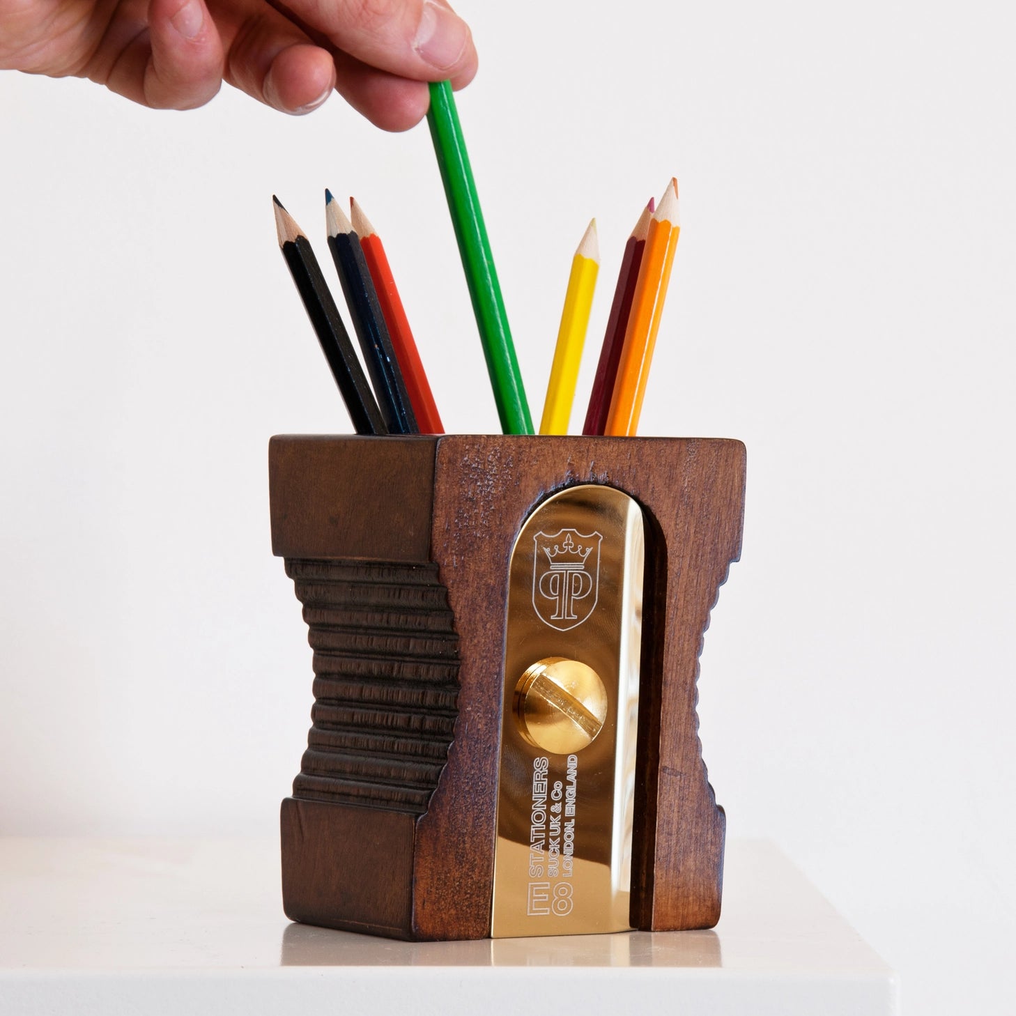 Hugely iconic and instantly recognizable, a design classic desk-tidy. This simple pencil-pot will keep your pencils, pens and desk top clutter looking sharper than the usual dull desk accessory. The "Double" features an extra space for paper-clips and smaller accessories. The "Dark" has a gold plated blade.